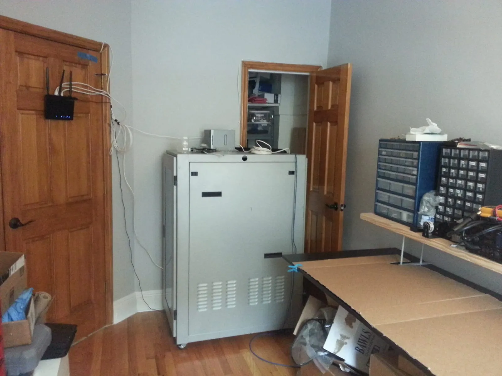 The rack, closed, in the corner of my computer room, with the closet that held the DIY rack behind it