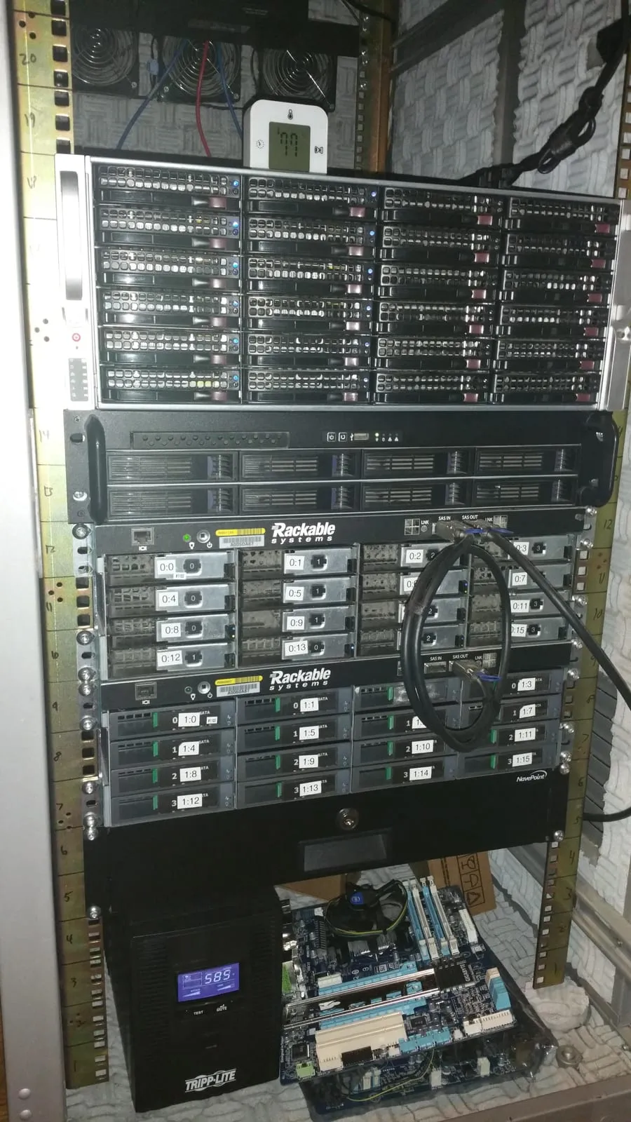 The rack: the SC846E16 on top, the 2U Norco ESXi server, then both Rackable SE3016s, with the Tripp Lite UPS below